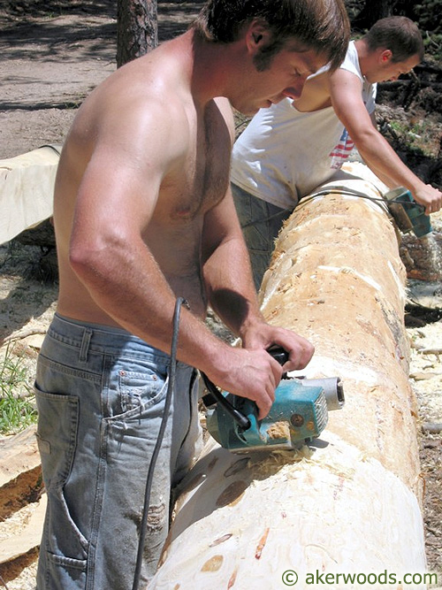 Peeling house logs 